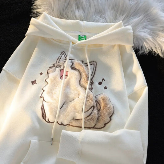 a real plush material happy singing cat design on a apricot color hoodie
