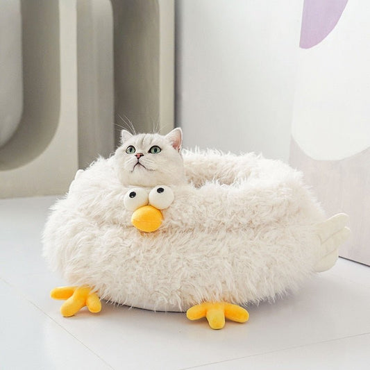 fluffy cat bed with very cute chicken design with yellow feet and beak that looks comfy for cats