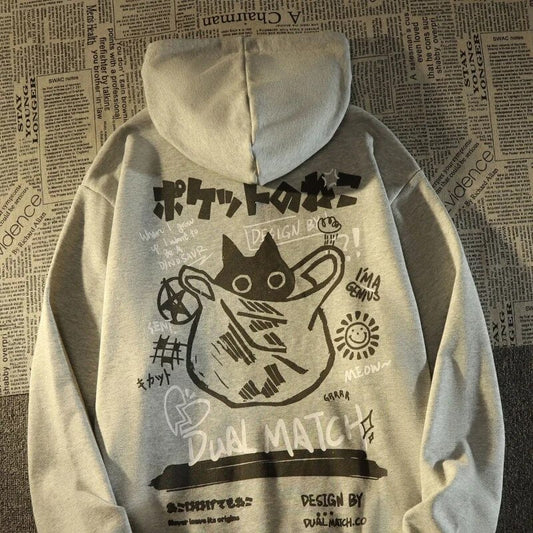 Harajuku style hoodie with a playful mix of doodles and a black cat with big Japanese characters