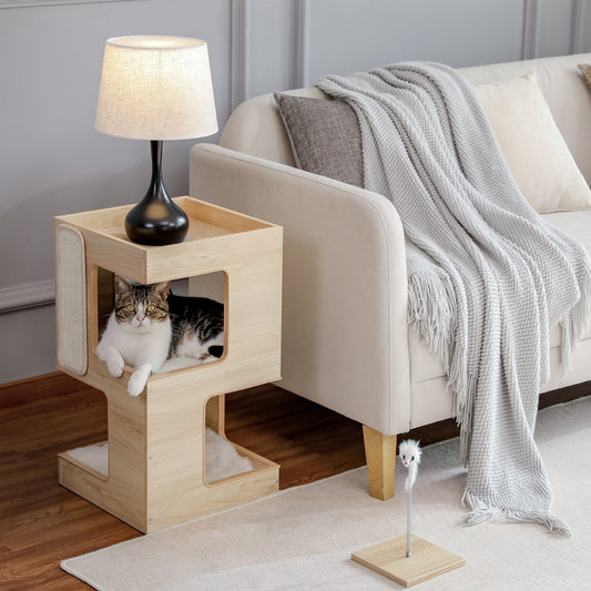 a cat chilling in the modern cat tree that act as side table