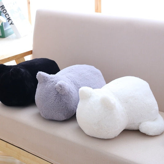 multiple colors of plushie cat on a sofa