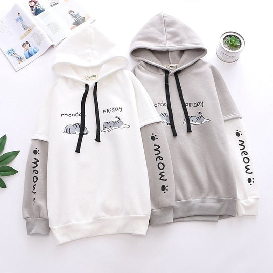 a pastel color cat hoodie with kawaii design showing the mood of cats on monday blues and happy friday