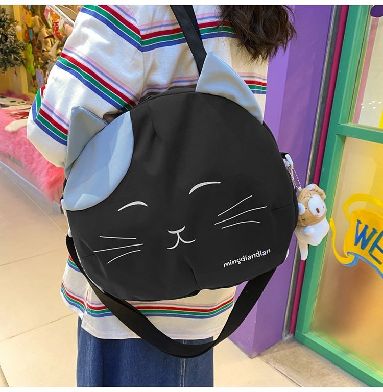 Smiling cartoon cat crossbody bag