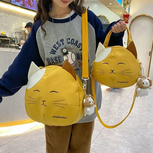 Smiling cartoon cat crossbody bag