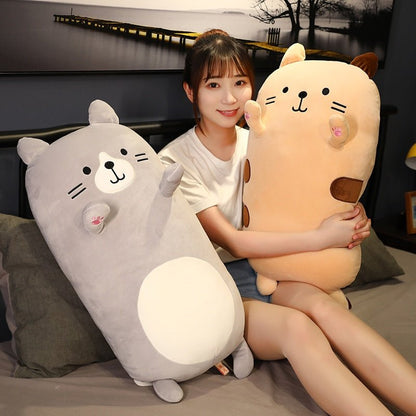 a lady hugging jumbo cat plush with different colors