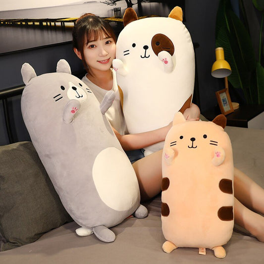 a lady holding japanese cute plushies of giant cats