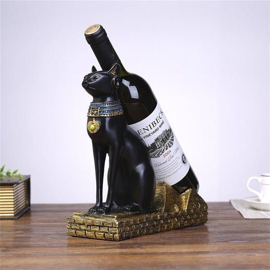 a black color eqyptian cat sculpture that functions as a wine holder for luxury home decor