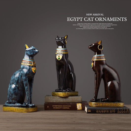 a set of egyptian cat sculpture in different colors for home decor