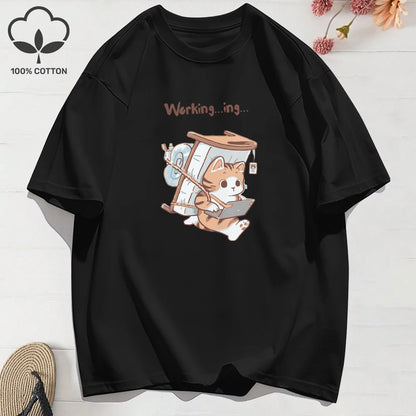 Black t-shirt with a cartoon cat design carrying a bed and working on a laptop