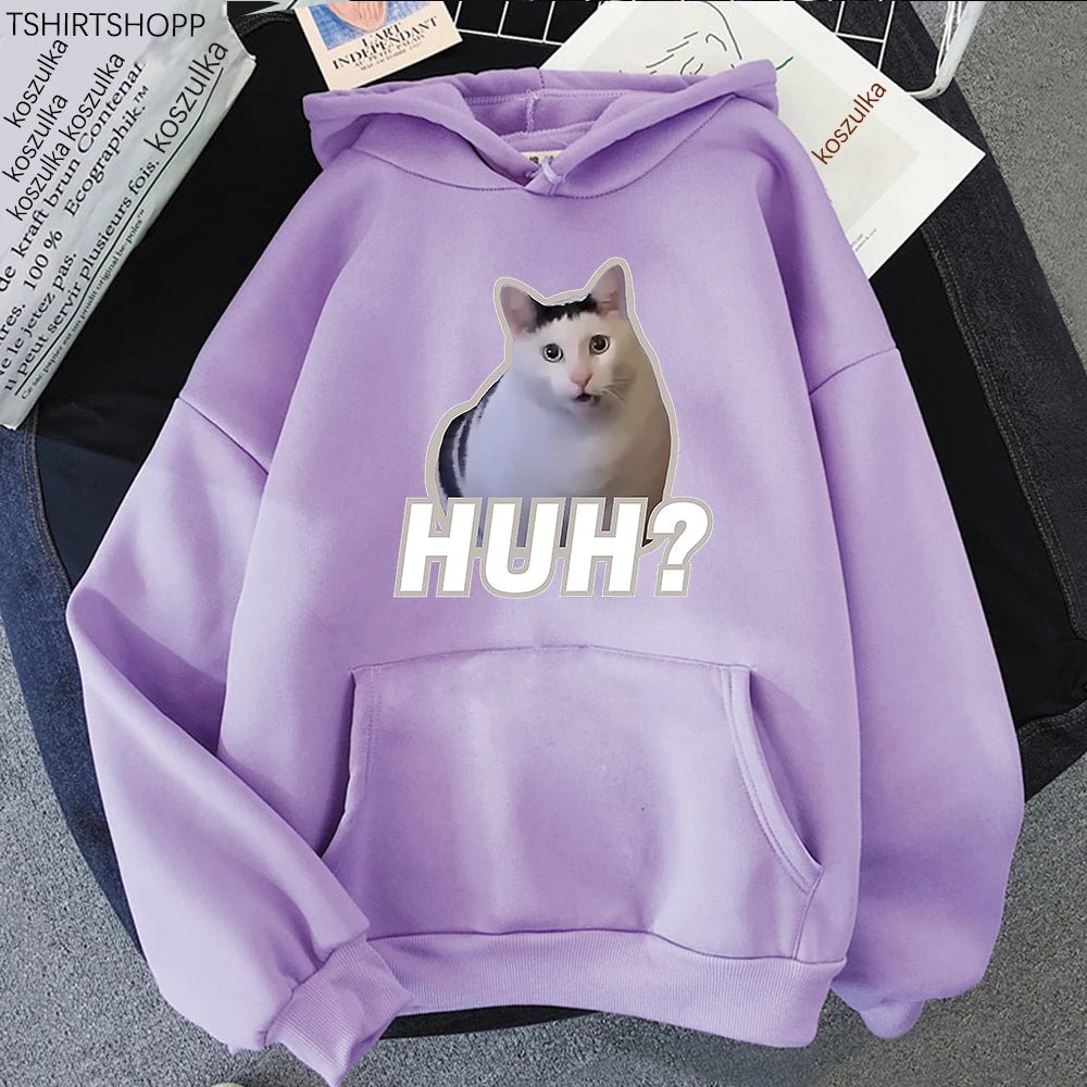Close-up of the "Huh" cat meme on vibrant purple hoodie.