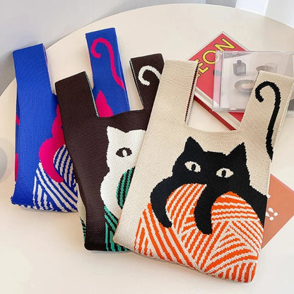 Collection of 'Japanese-Style Knitted Cat Wrist Bag' in Beige, Blue, and Black