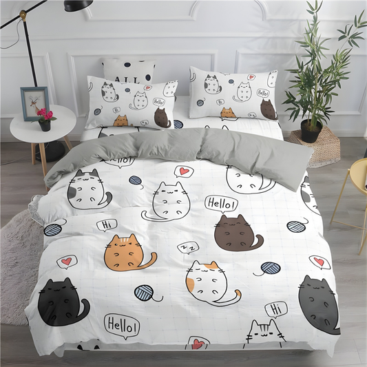 Cat-themed bedding set with many cute cartoon cat prints saying hello in a bedroom with a plant and side table.