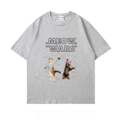 Cats with lightsabers battling on a light gray color t-shirt with “Meow Wars” text