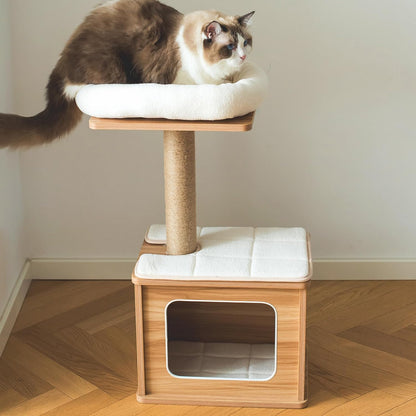 Cat sitting on a 2 level elevated wooden cat tree with white cushioned platforms
