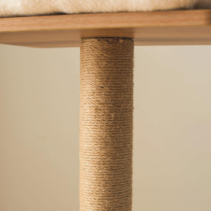 Close-up of a cat tree with a textured wooden post and cushioned top.