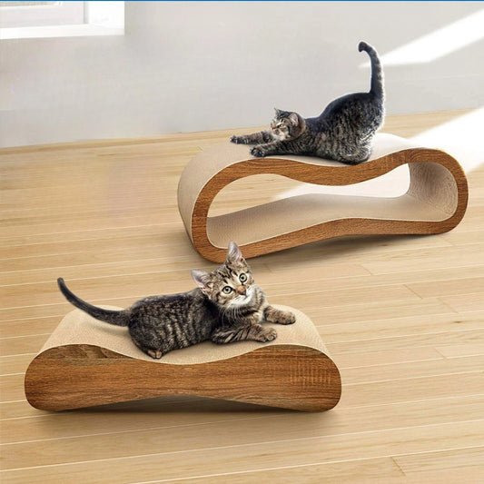 Two cats on a nice looking corrugated cardboard cat scratcher pad in a room with a window.
