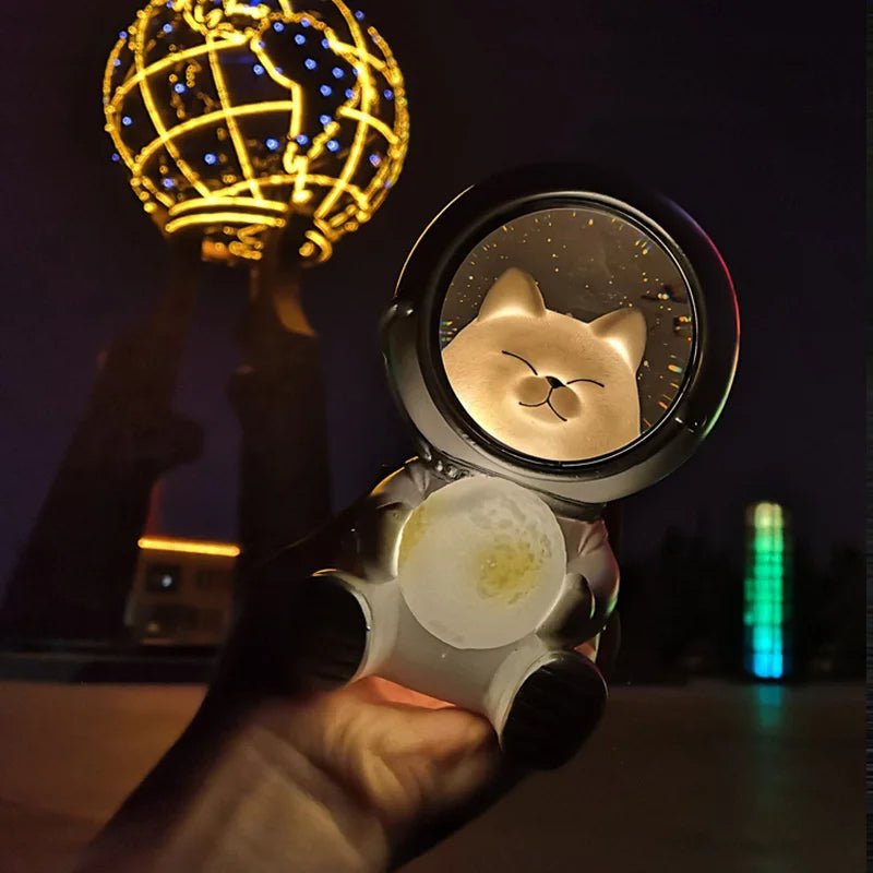 Close-up of 'Astronaut Cat Night Lamp' Holding LED Moon on hand