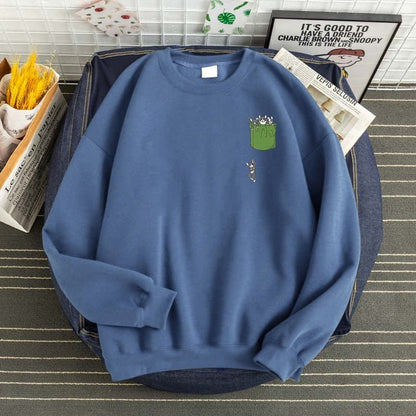 a blue cat sweatshirts for humans with a printed pocket full of cats