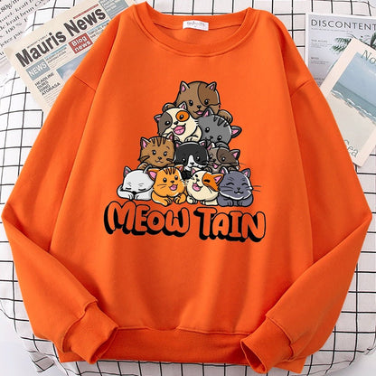 an orange color cat pattern sweater with a mountain of cats design