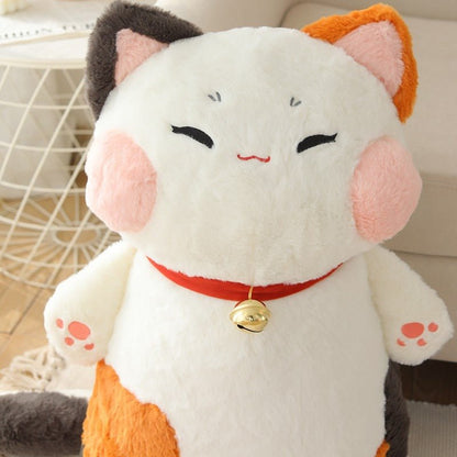a close up of a jumbo cat plush from calico breed