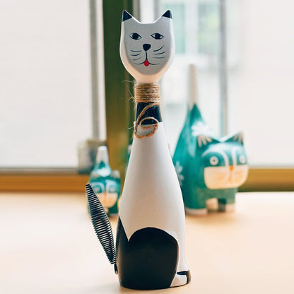 a white cat statue for home decor made from wooden