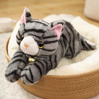 a realistic cat stuffed animals of a grey cat