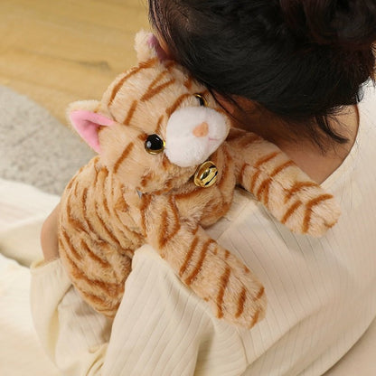 Adorable realistic cat plush with bell