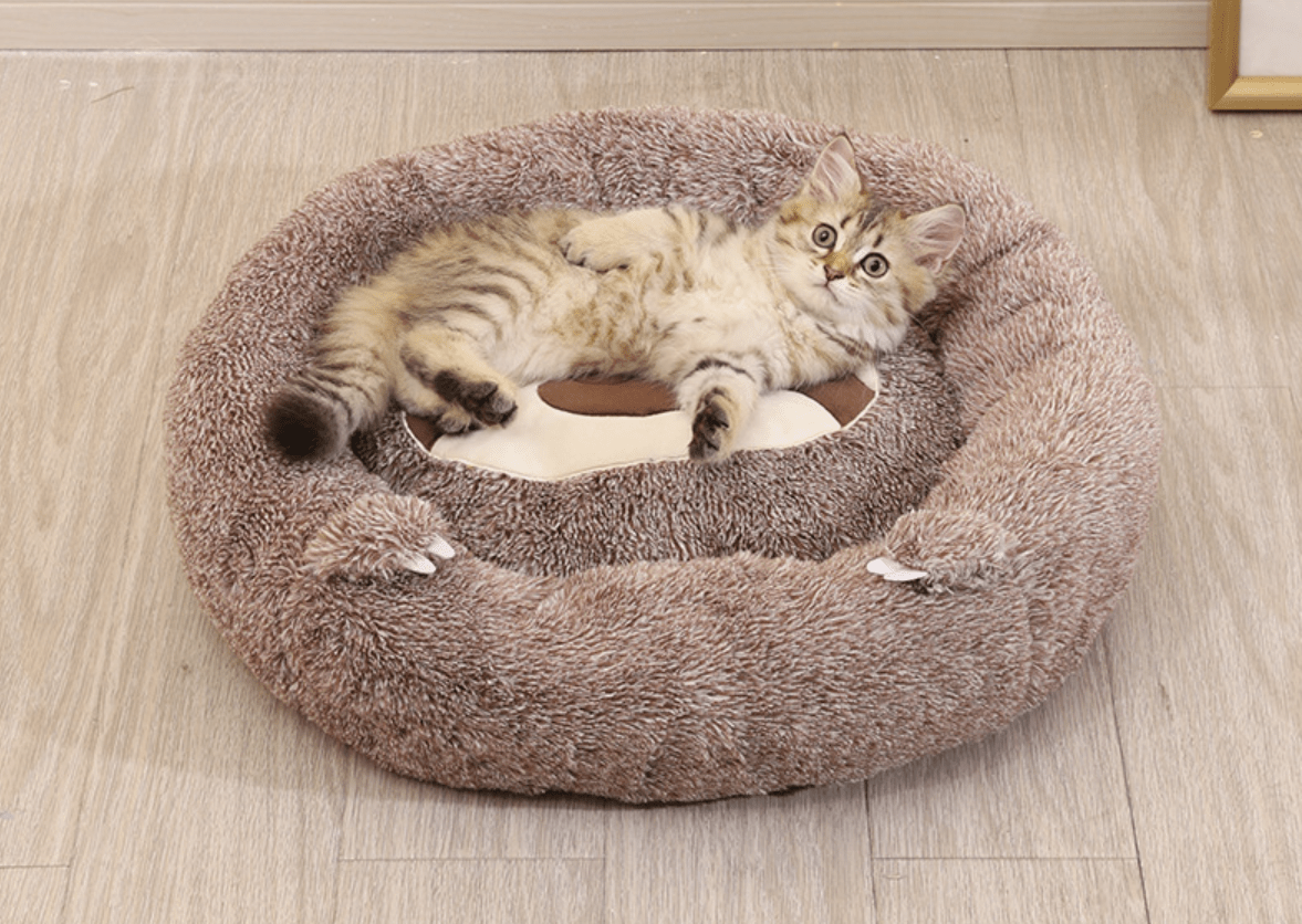 a round shaped bedding for cat with a cute sloth design that gives good sleep to pets