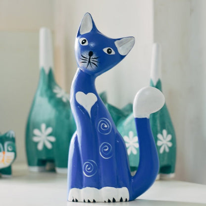 a cat statue of a mommy cat in blue color with a big heart