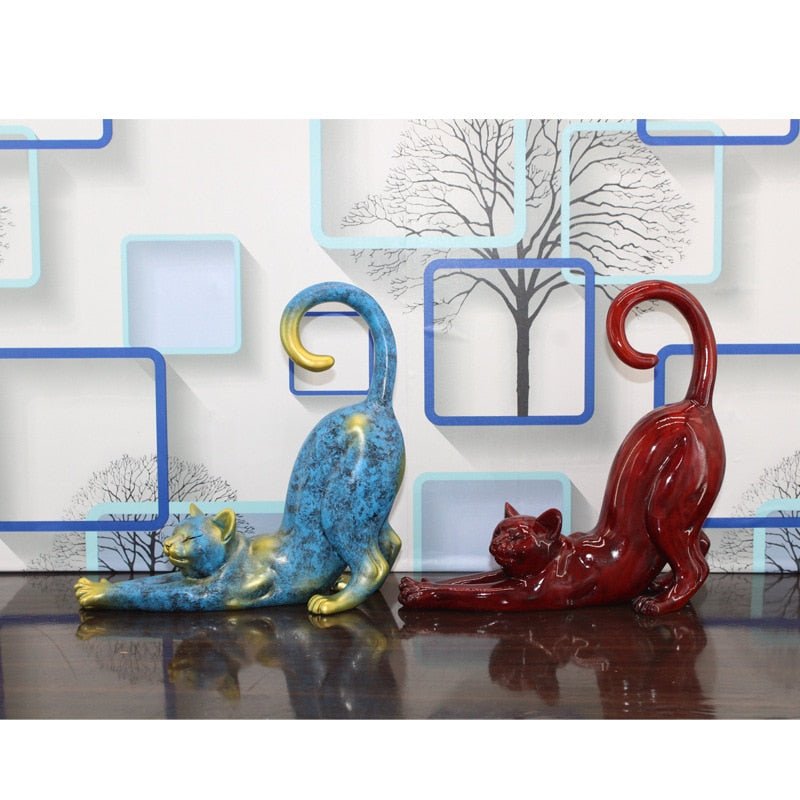 a set of stretching cat sculptures for home decor