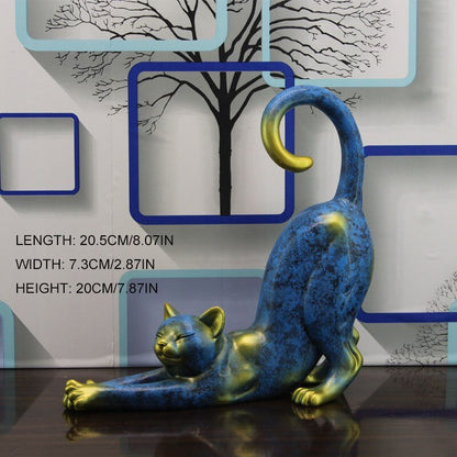 a cat statue in blue and gold color for home decor