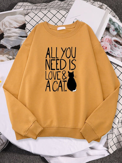 a cat print sweatshirt with the word all you need is love & cat