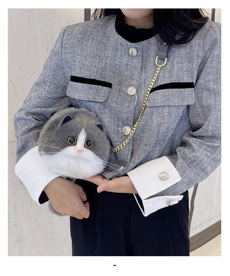 cow cat sling bag that is so realistic and looks like real cat