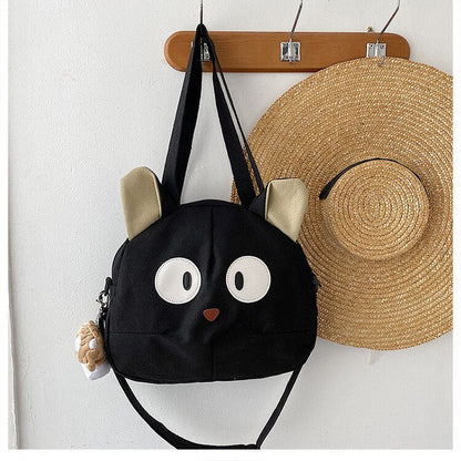 big ears and eyes black cat tote bag from meowgicians