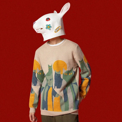 man wearing a cool looking beige color cat themed sweatshirt printed with abstract cat illustration