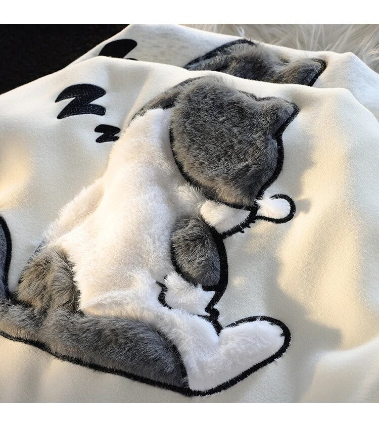 Close-up of the fluffy cat design on the hoodie