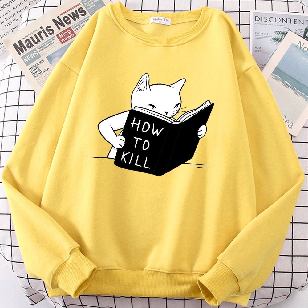 a yellow funny cat sweatshirts with a cartoon of a cat learning how to kill