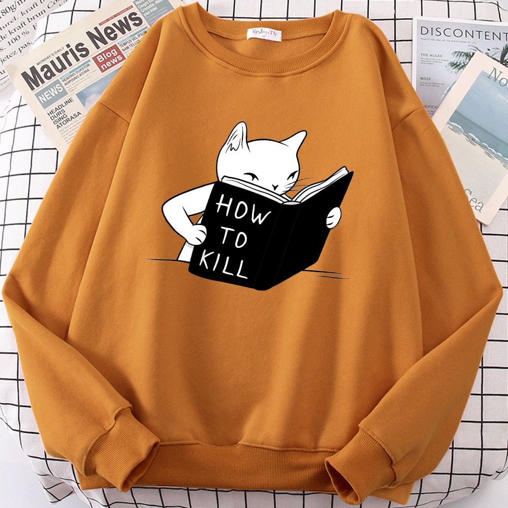 an orange crazy cat lady sweatshirt with a cartoon of a cat learning how to kill