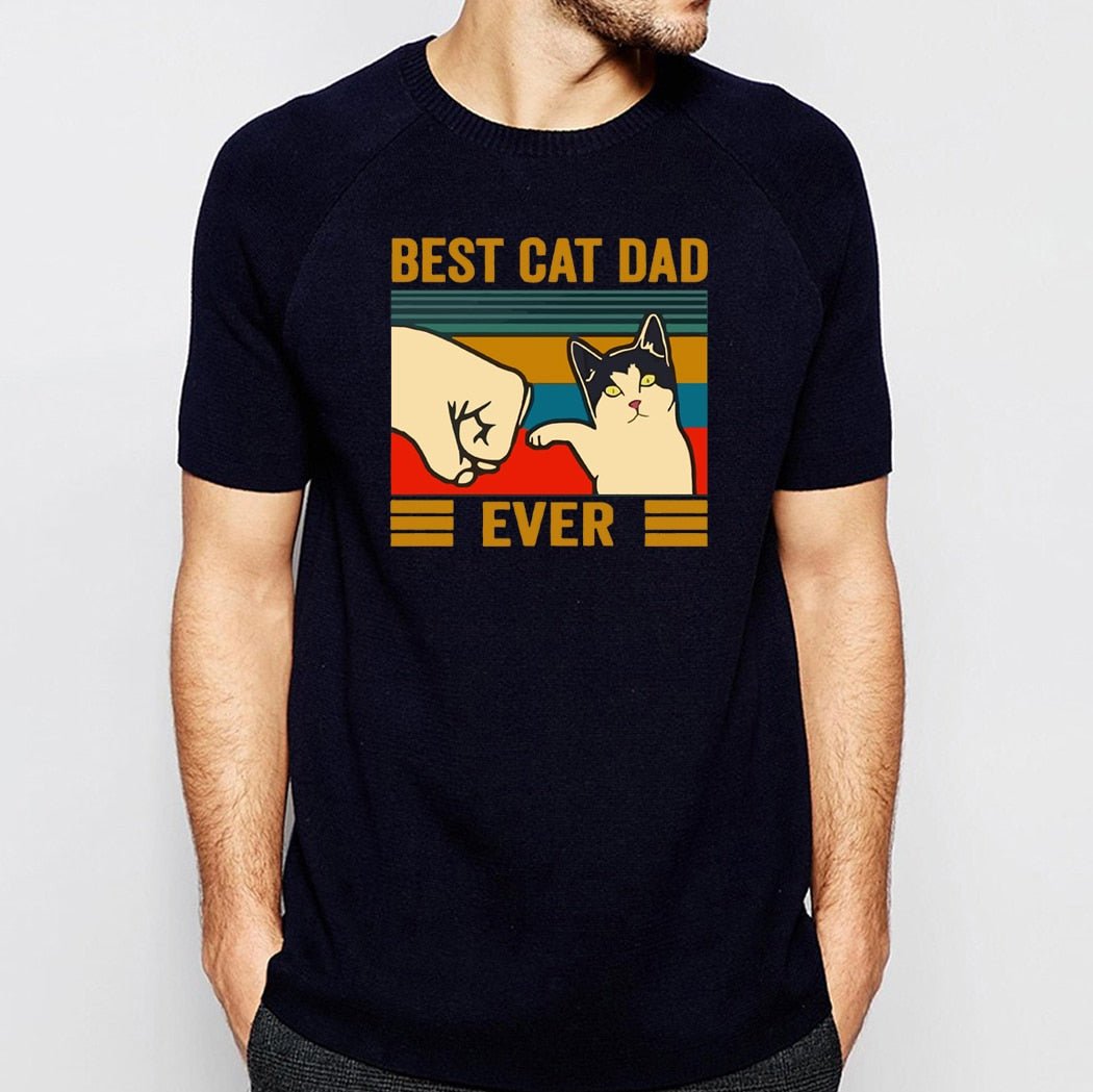 Man wearing black 'Best Cat Dad - Fist Bump' t-shirt of a cat giving fist bump.