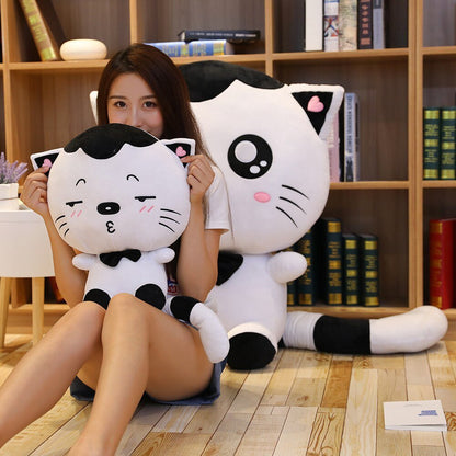 a lady hugging a kawaii cat plushie in black and white color