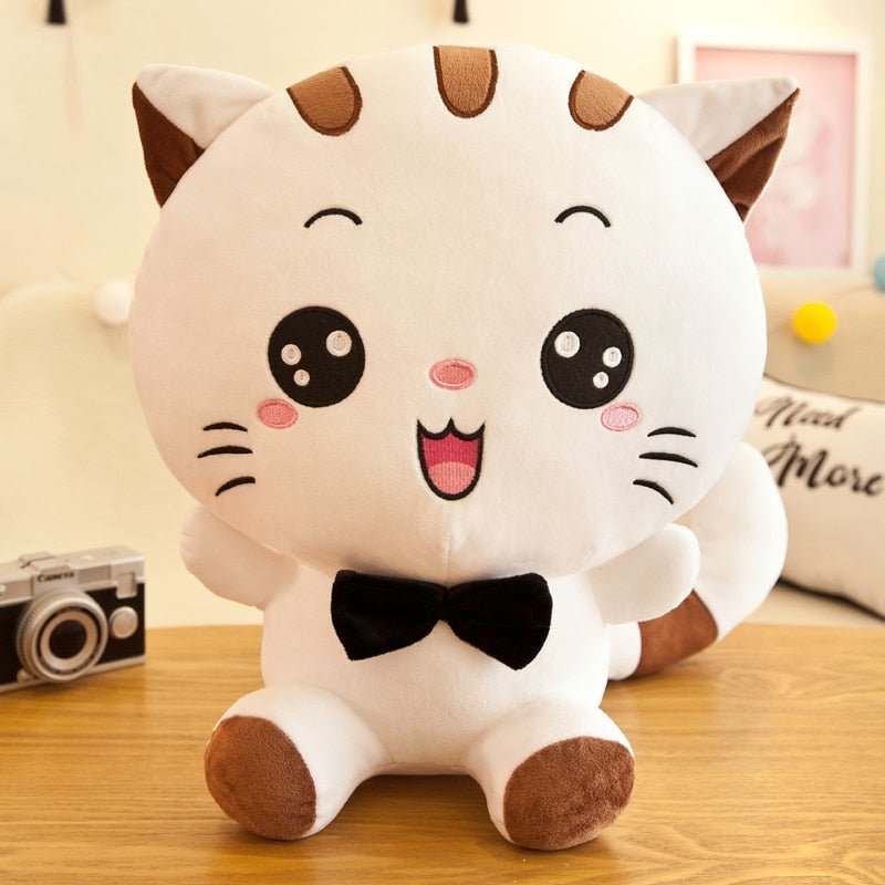 a white giant cat plush with a friendly face