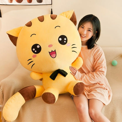 a lady holding a big cat plush of a cute cat