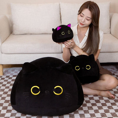 a lady with a japanese plush of black cats