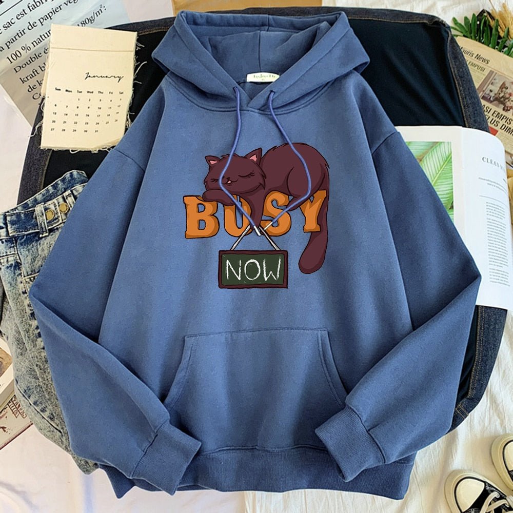 a blue color hoodie for cat dads to wear on lazy days featuring a brown sleeping cat