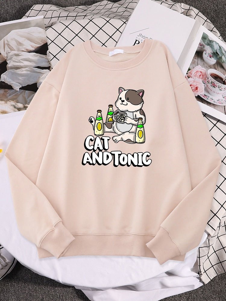 a biege color cat lover sweatshirt  with picture of a cat drinking tonic drinks