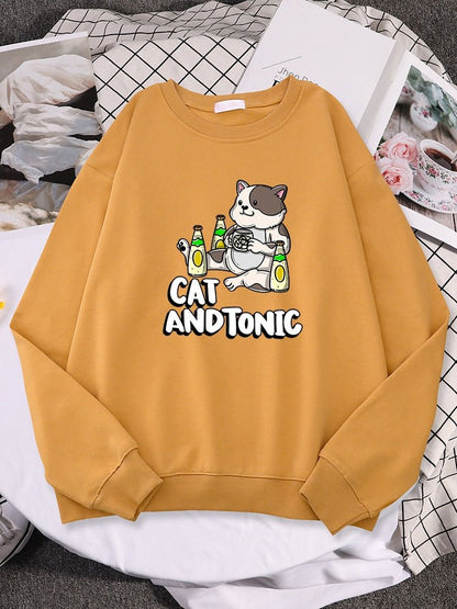an orange color sweatshirt with  picture of a cat drinking tonic drinks