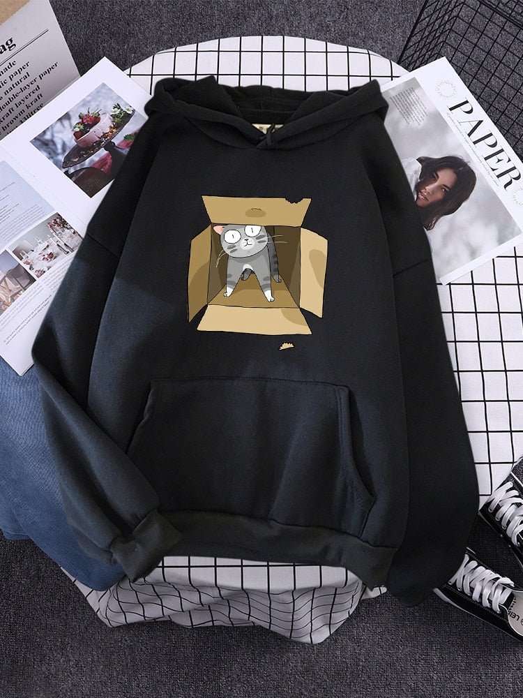 a black hoodie made for mens who love cats featuring a cute design of a cat in a box