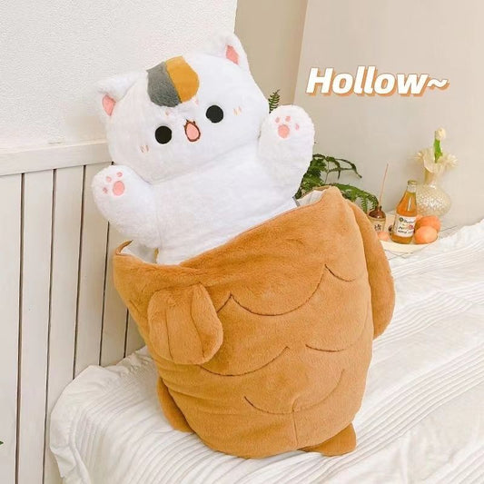 A soft brown giant size taiyaki cat plush with a white cat plushie inside saying hello to you