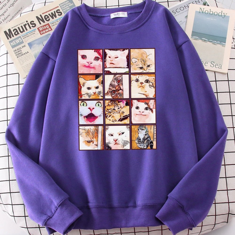a purple sweatshirt with cat memes 