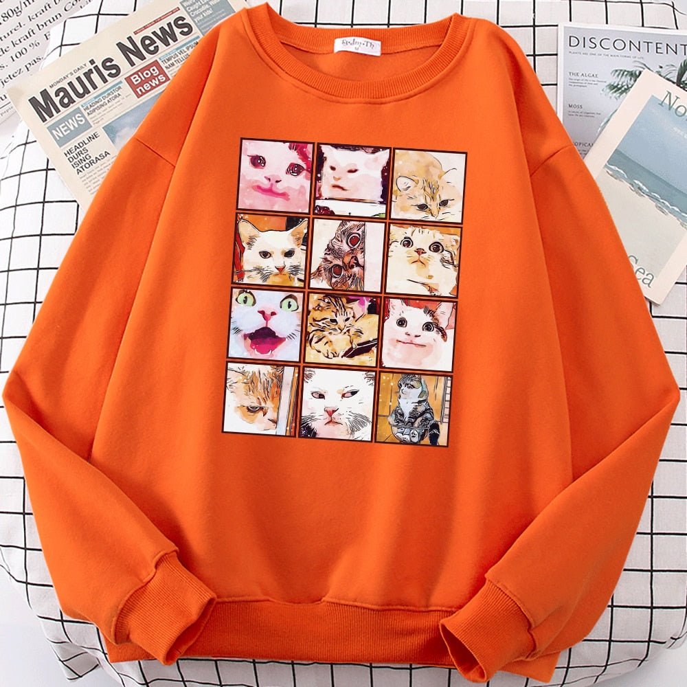 an orange sweatshirts with cats on them featuring famous memes